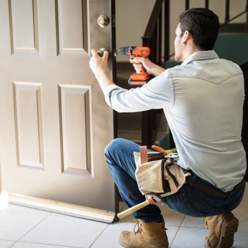 Man installing a door lock